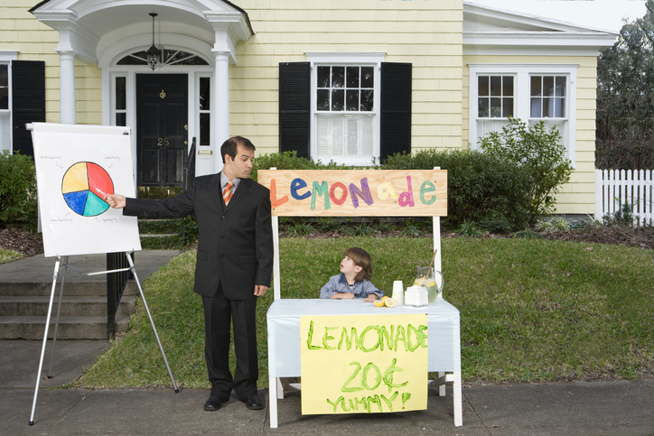 businessman giving presentation at lemonade stand